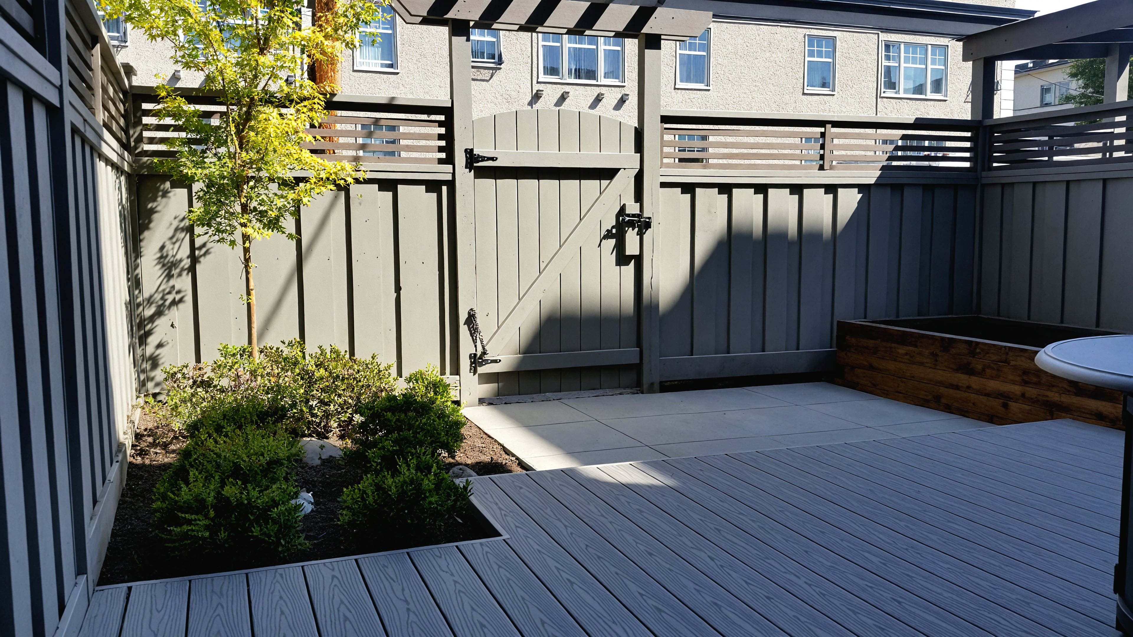 Composite decking, Garden boxes, Artificial turf and Concrete slabs at the Alder St project.