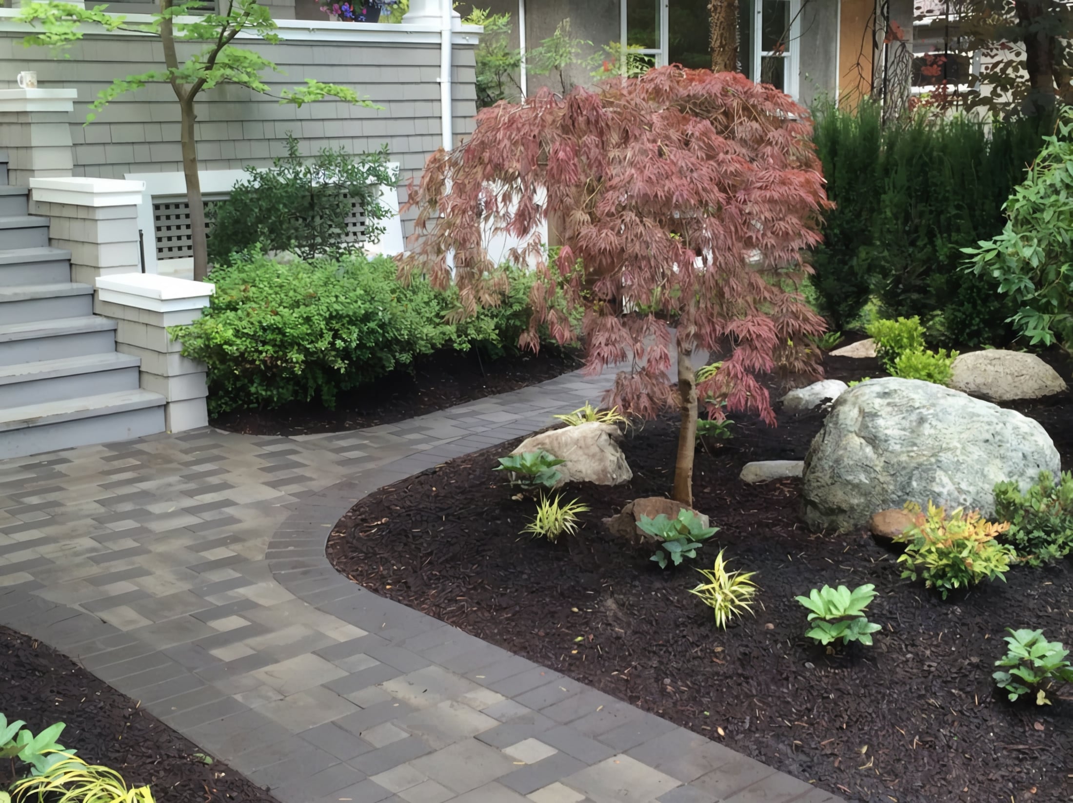 Interlocking pavers, Micro clover, Garden beds and Plants at the West 11th project.