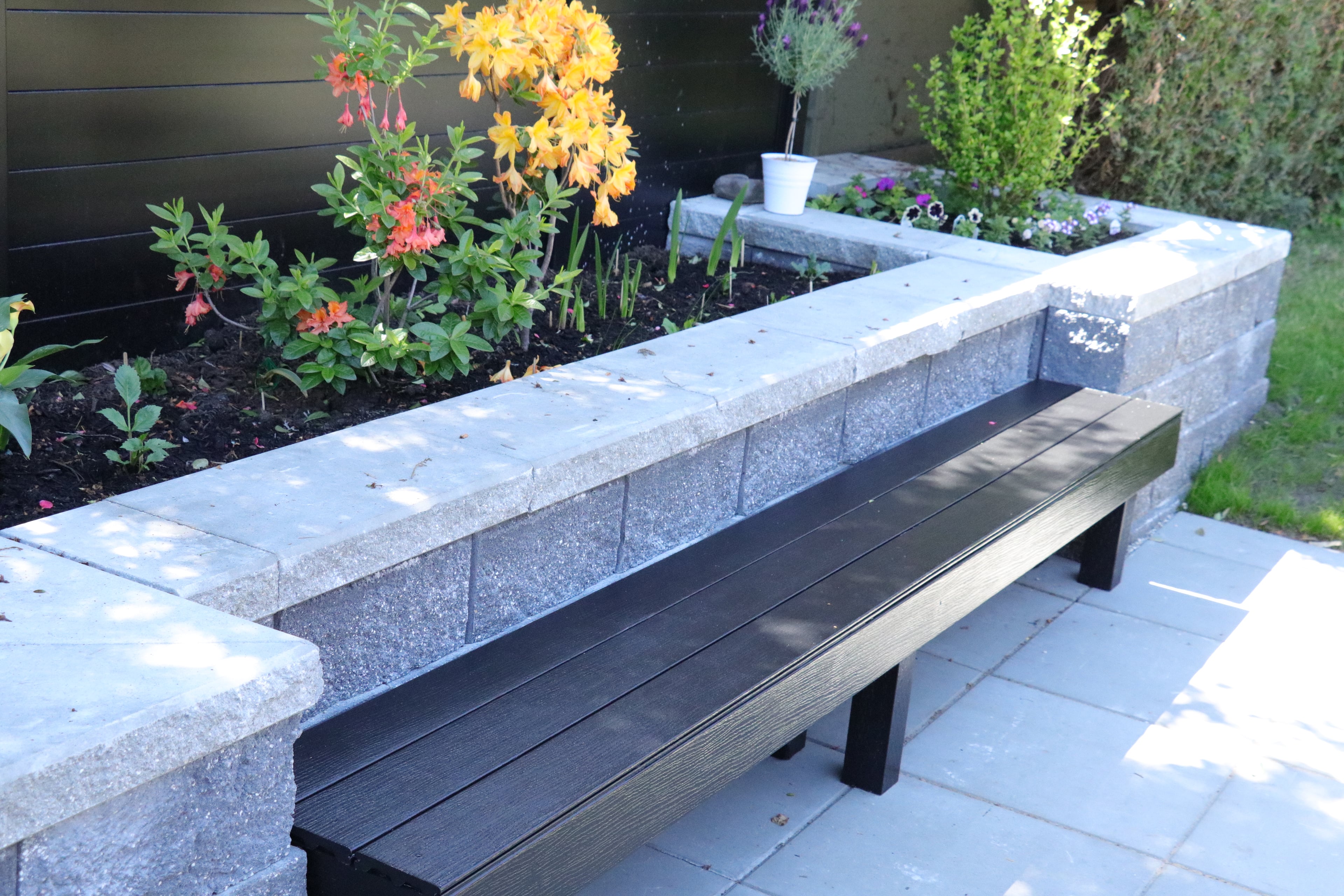 Aluminum fencing, Retaining walls, Seasonal planting and Hedge trimming at the West 35th project.