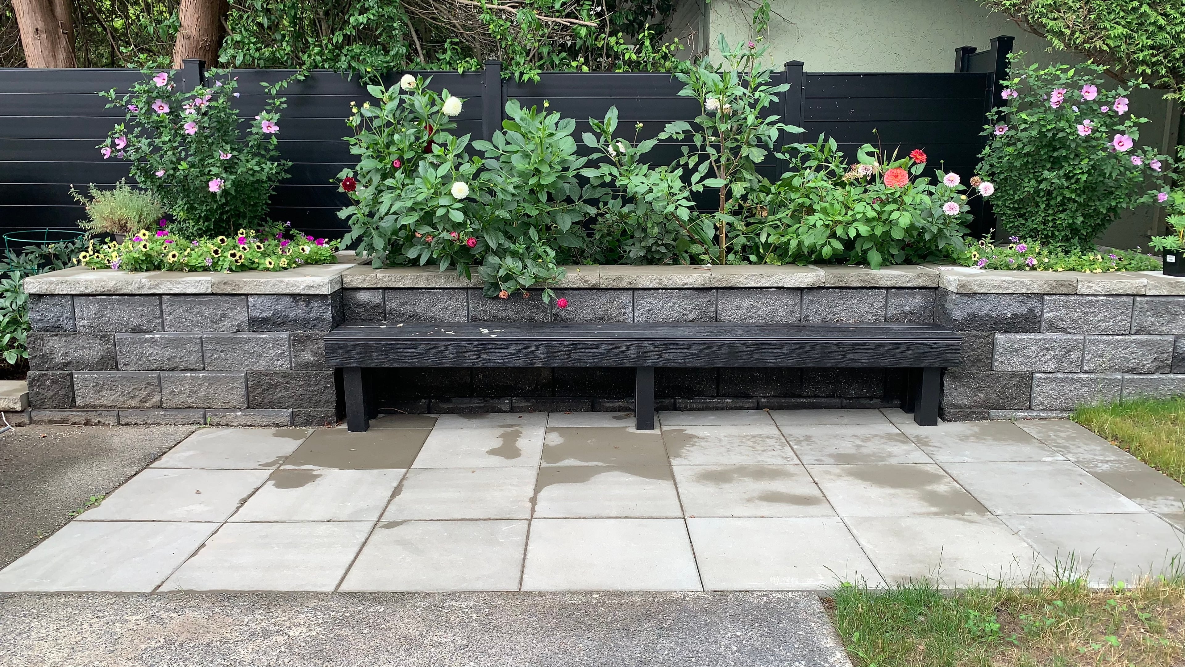 Aluminum fencing, Retaining walls, Seasonal planting and Hedge trimming at the West 35th project.