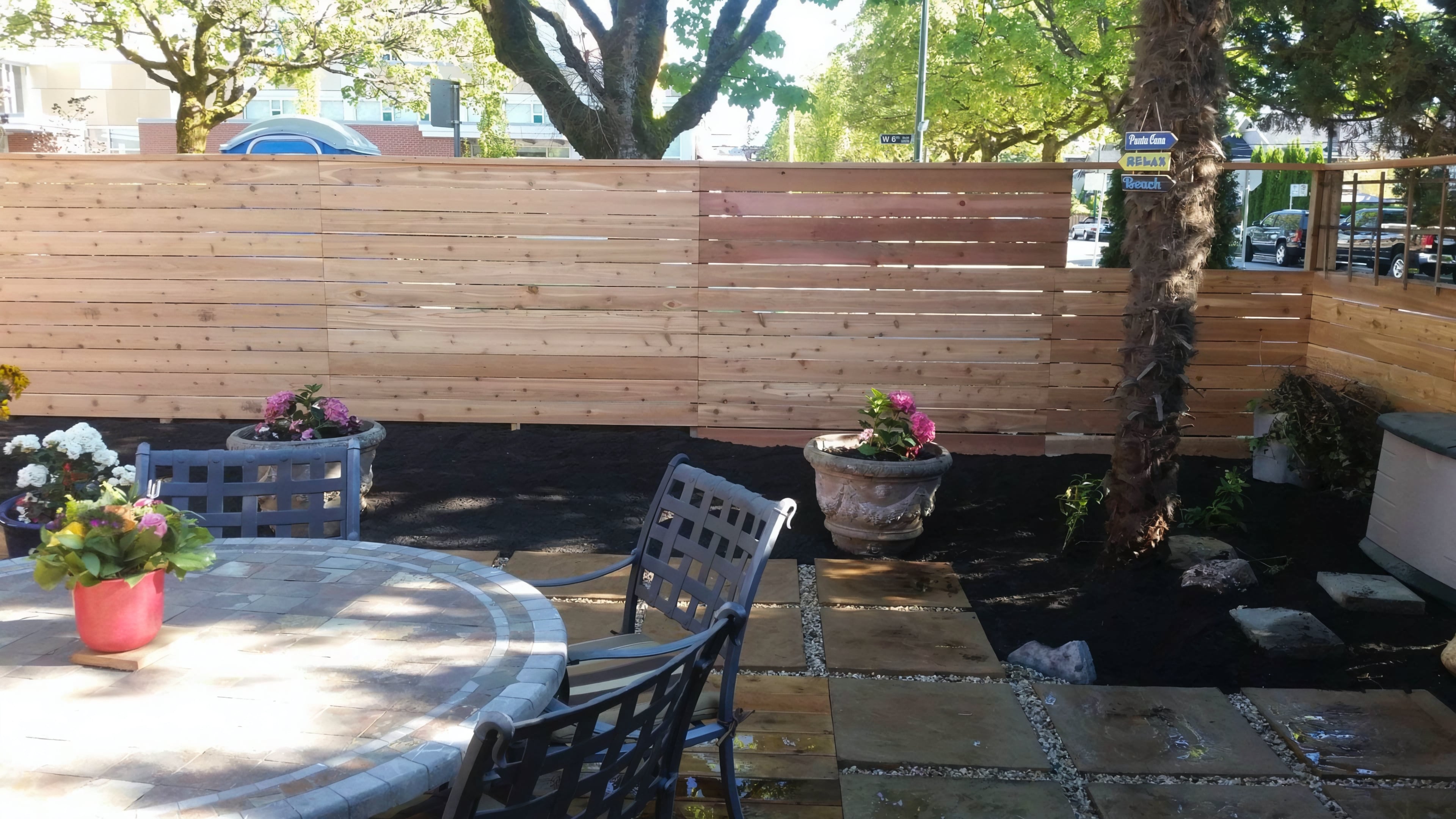 Cedar fencing, Cedar patio, Concrete slabs and Trees at the West 6th project.