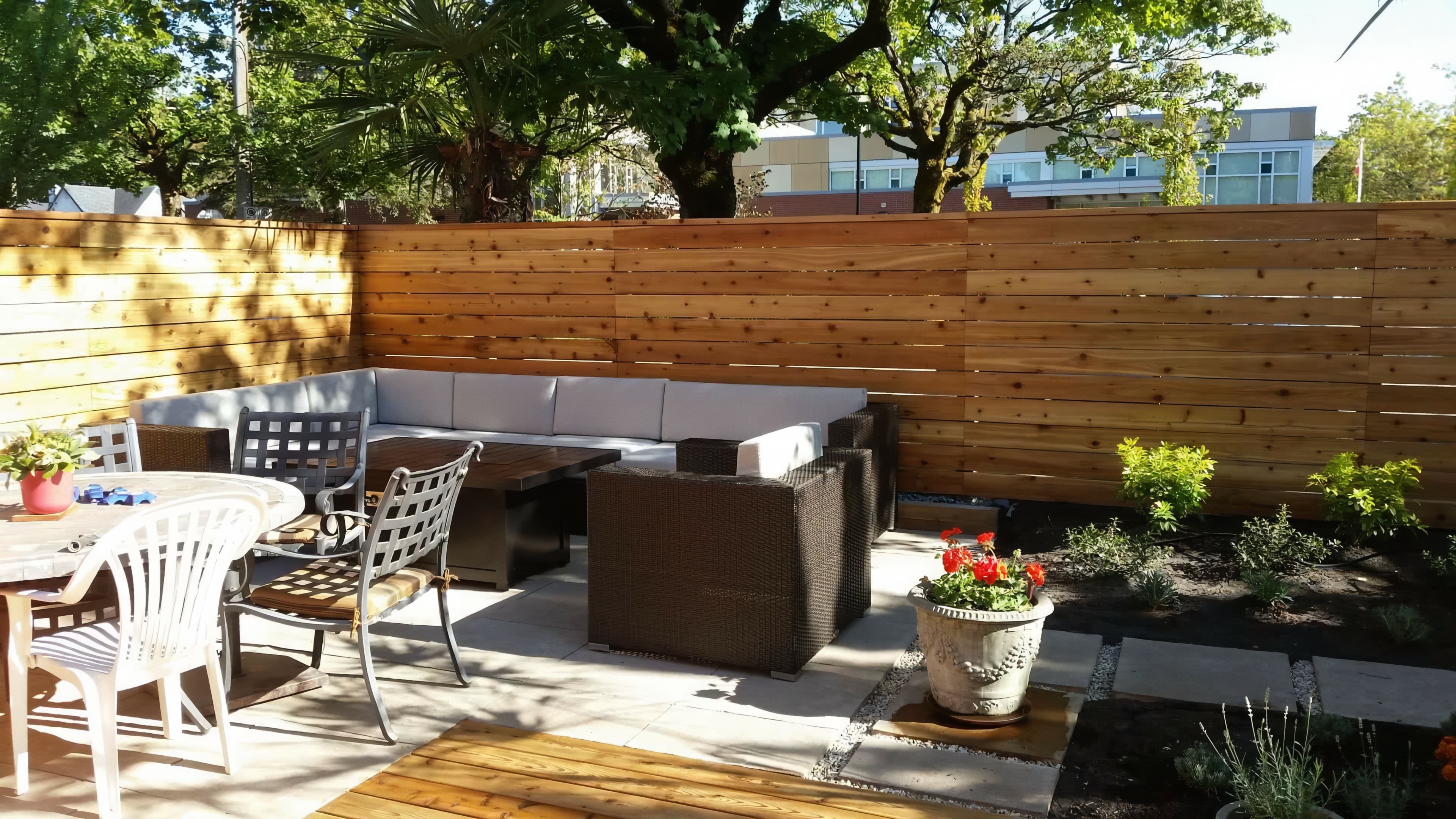 Cedar fencing, Cedar patio, Concrete slabs and Trees at the West 6th project.
